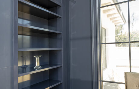 Custom build-in shelving and wall paneling in a full home remodel project.