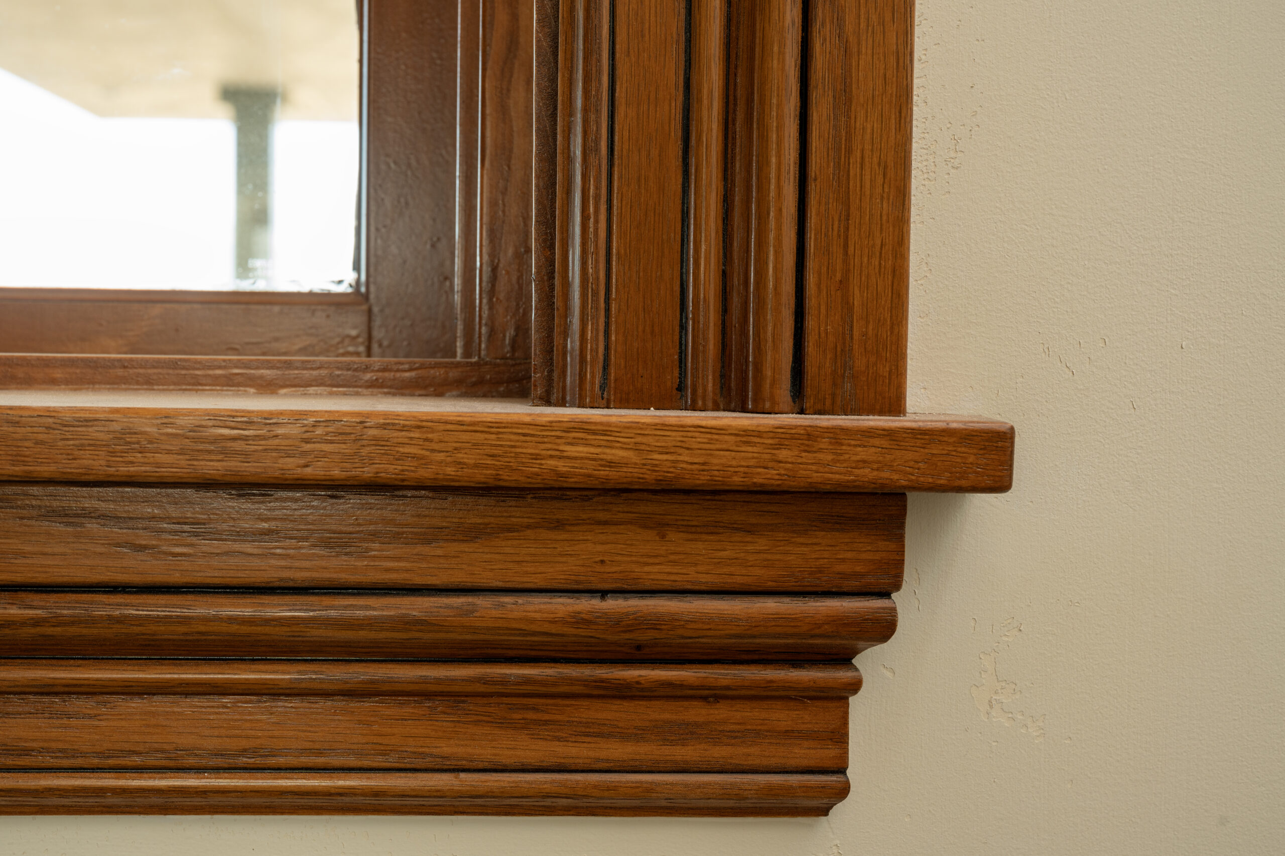 Beautiful wood molding installed around a window by Youngren Tradeworks