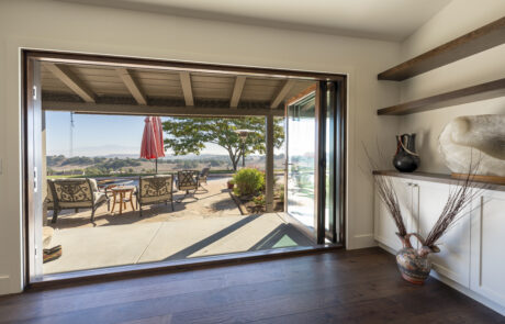 Folding accordion patio doors installed by Youngren Tradeworks