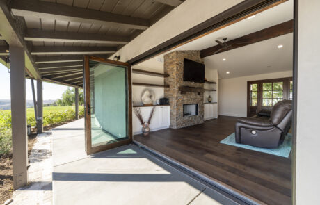 Built in wood shelving around a fireplace and custom wood mantle