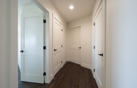 Hallway with bathroom doors, bedroom doors, and closet doors installed by Youngren Tradeworks
